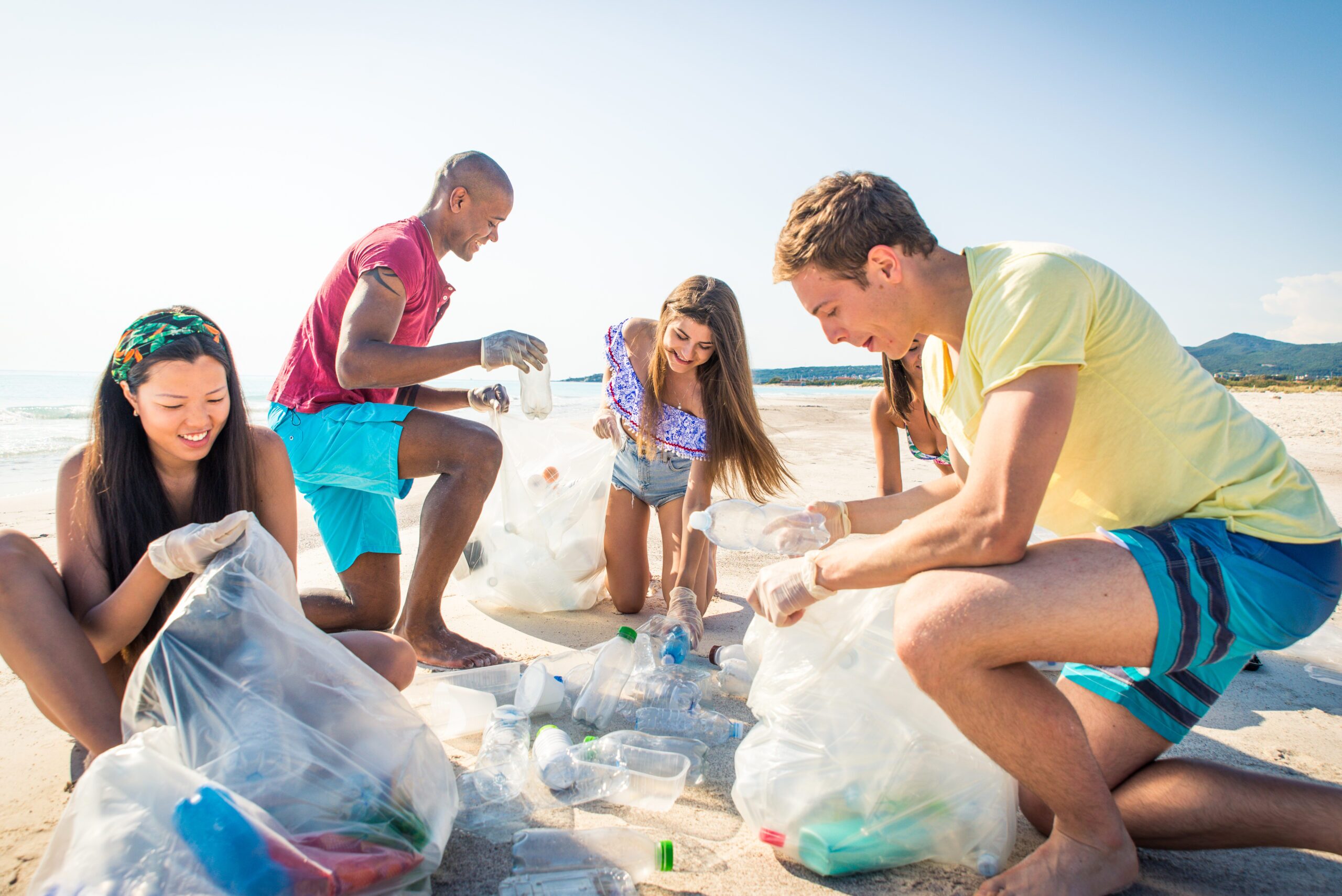 Group,Of,Eco,Volunteers,Holding,Bags,With,Plastic,After,Sorting