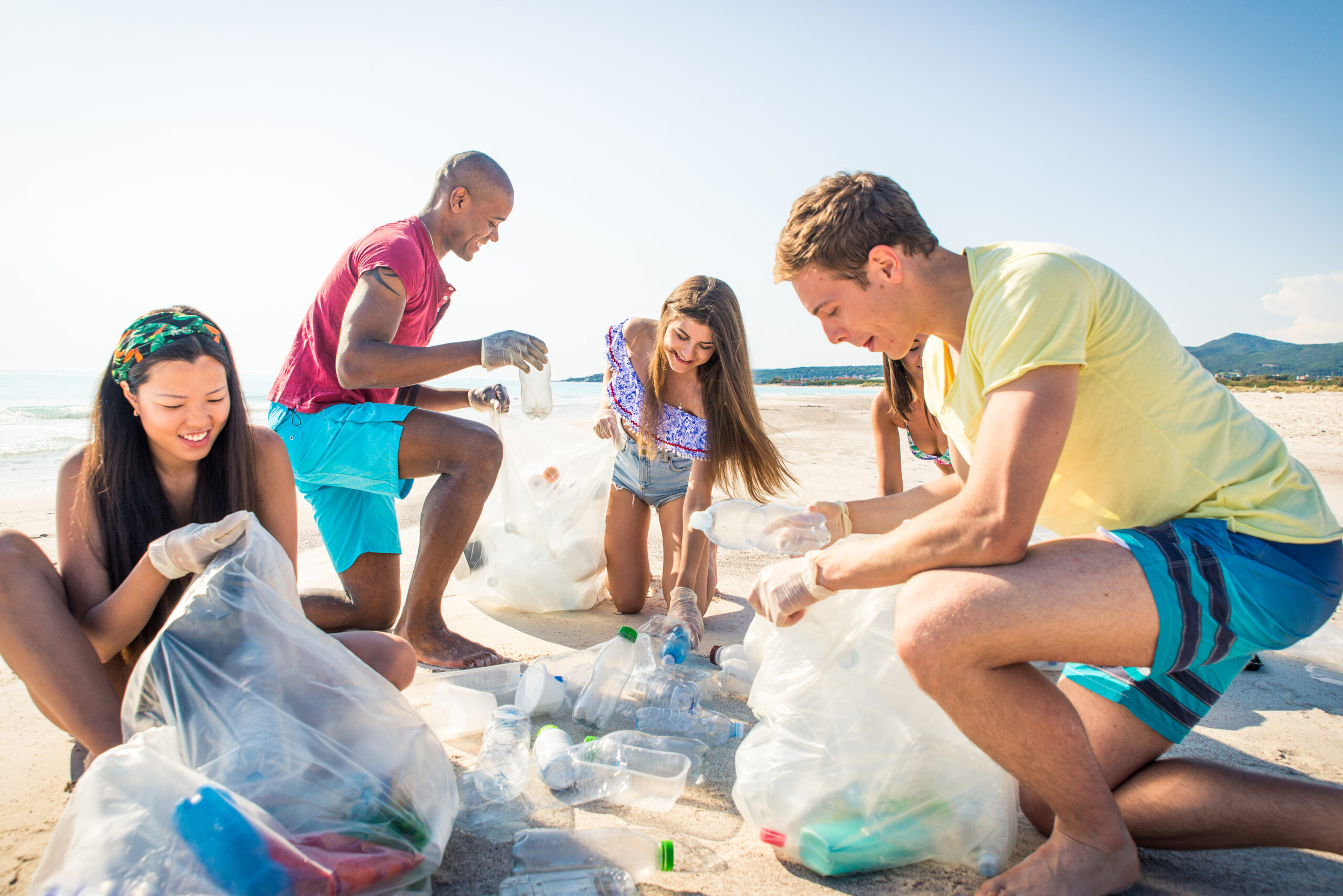 Group,Of,Eco,Volunteers,Holding,Bags,With,Plastic,After,Sorting